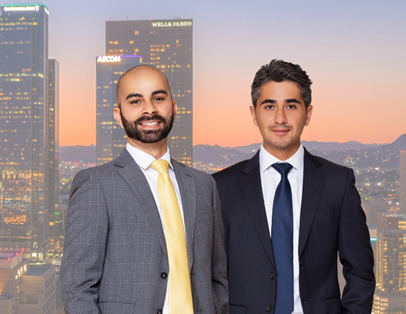 Firouzi and Salem standing next to eachother in front of city backdrop